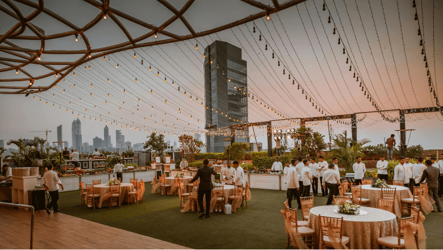Elegant reception tables with evening skyline
